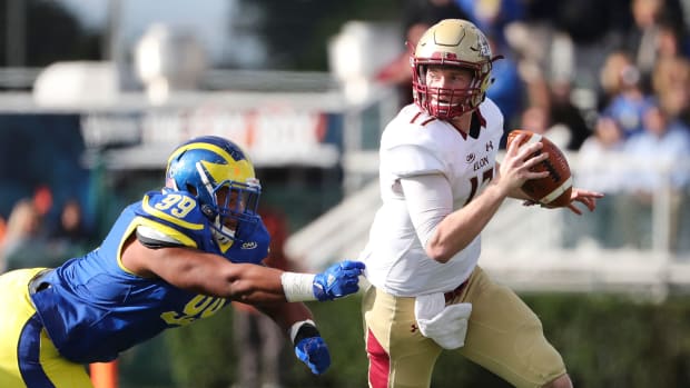 Delaware's Cam Kitchen flushes Elon starting quarterback Davis Cheek from the pocket before Cheek injured himself on the play in the first quarter at Delaware Stadium Saturday. Cheek did not return to action. Ud V Elon  